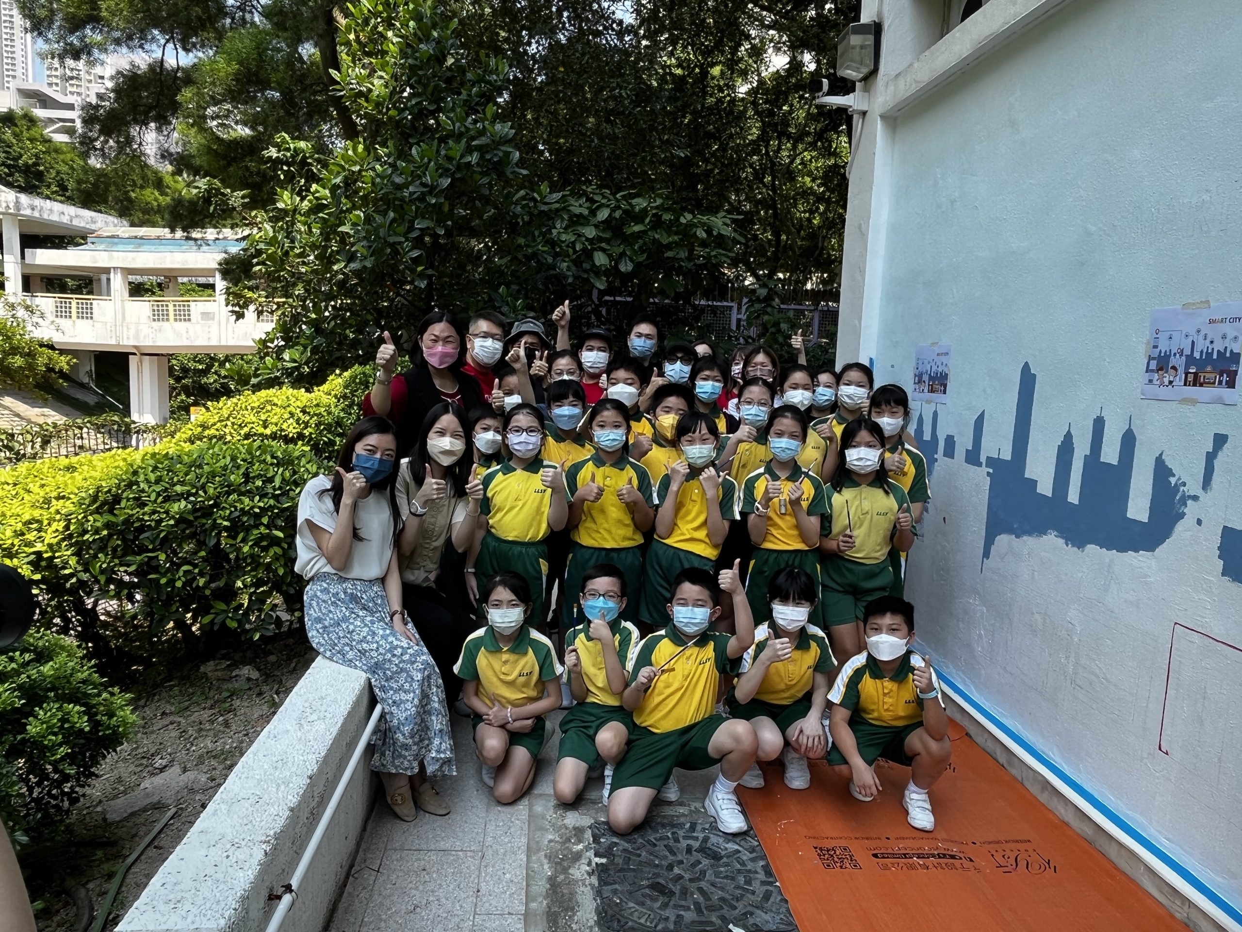 Cherrians design and help paint a school mural led by renown local artist Joe Yiu for Hong Kong Move On